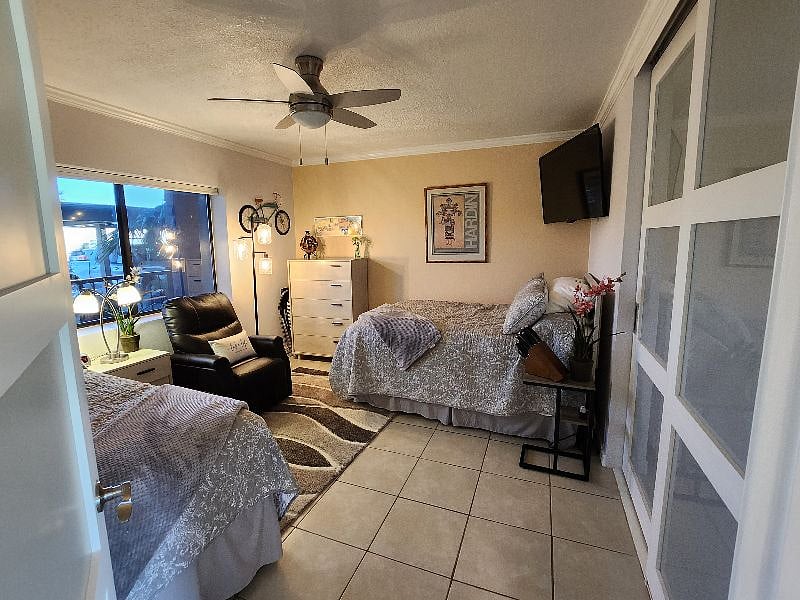 2nd bedroom with two full beds, 50-inch smart TV, and seating area. Wi-fi included!