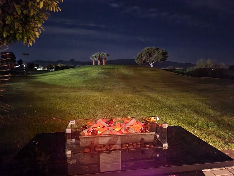 Enjoy the electric fireplace and beautiful view at night.