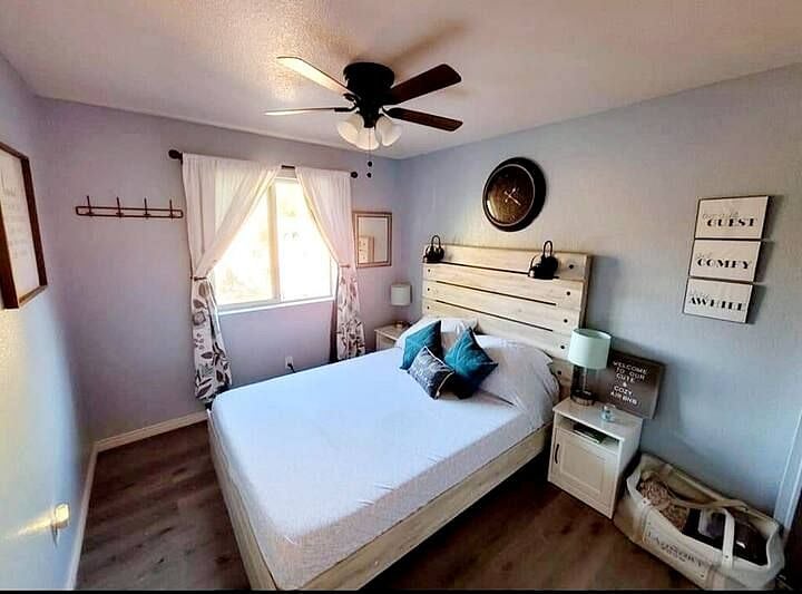 Queen Guest Bedroom - Comfortable queen bedroom featuring a gel memory foam mattress, blackout curtains, Smart TV, and bedside lighting for a restful night's sleep.