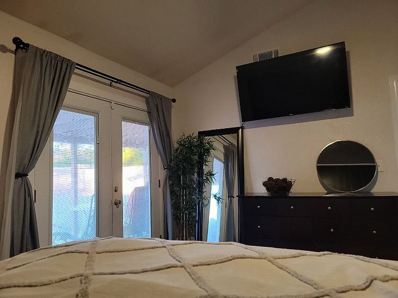 California King Suite - While winding down at the end of the day, enjoy this spacious suite, which includes a 55" TV, Cathedral ceilings, & beautiful french doors that open directly to the backyard. 