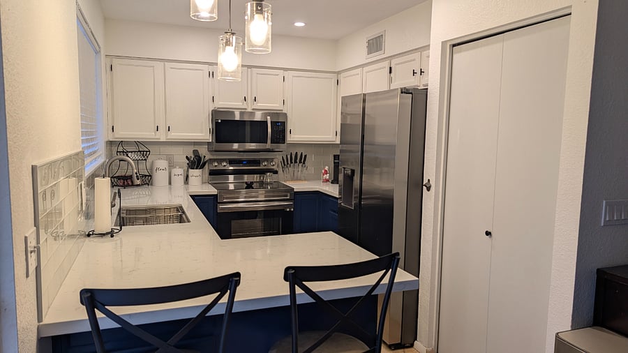 Kitchen - Fully stocked kitchen with stainless steel appliances, ample counter space, and everything you need for home-cooked meals.