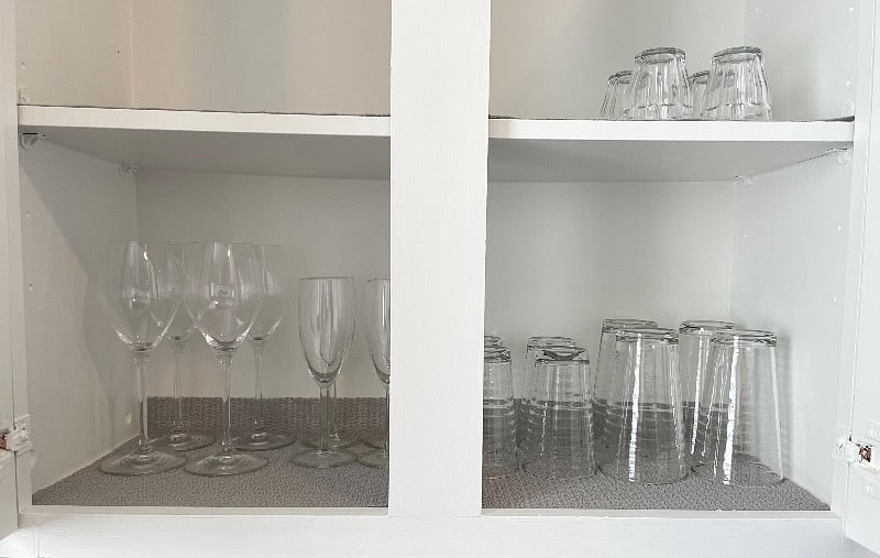 kitchen is stocked with all the basic necessities including a blender, rice cooker, plates, pots, utensils, flatware, keurig coffee maker, pans, grater, strainer