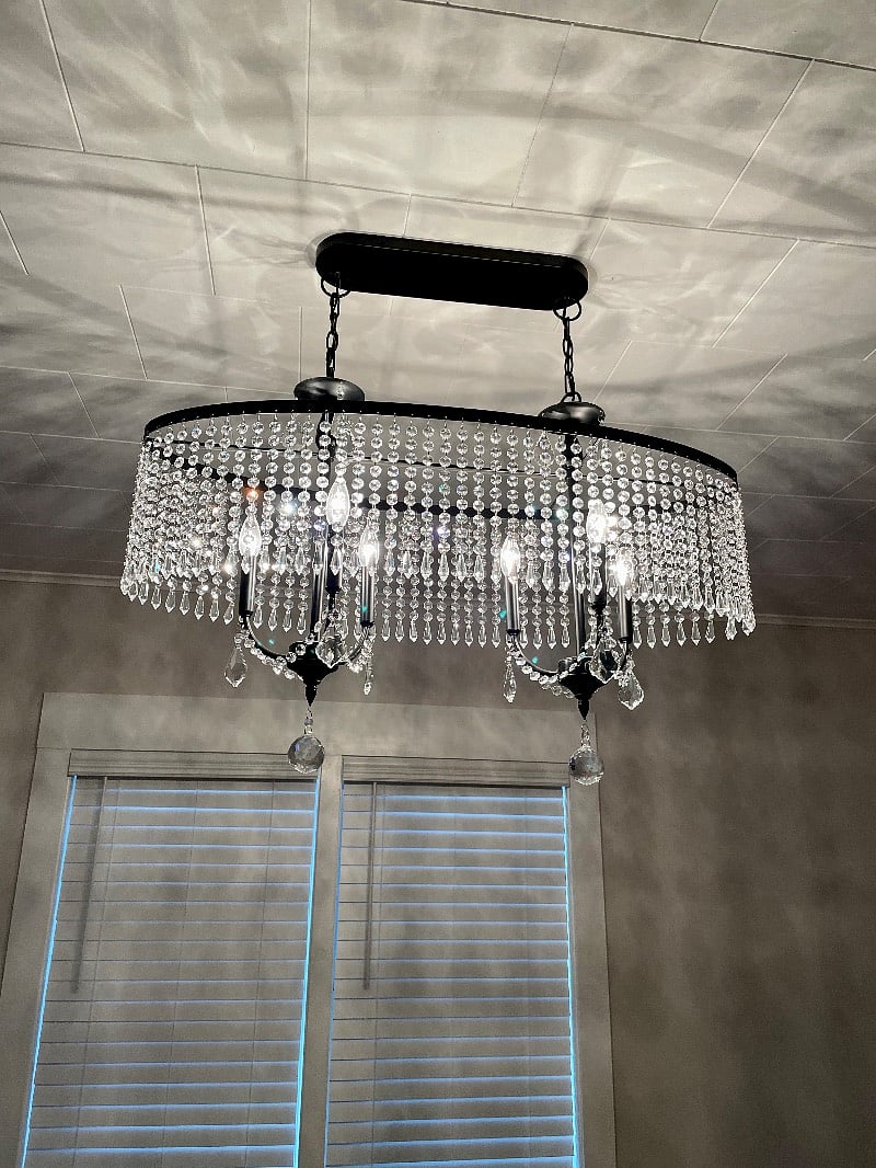 Crystal chandelier accents dining area