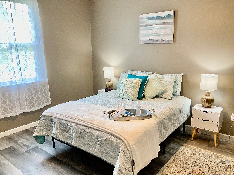 New queen bed and luxury bedding.