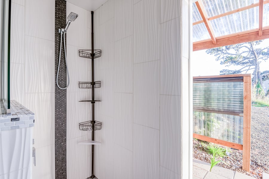 Passthrough from interior shower to exterior shower
