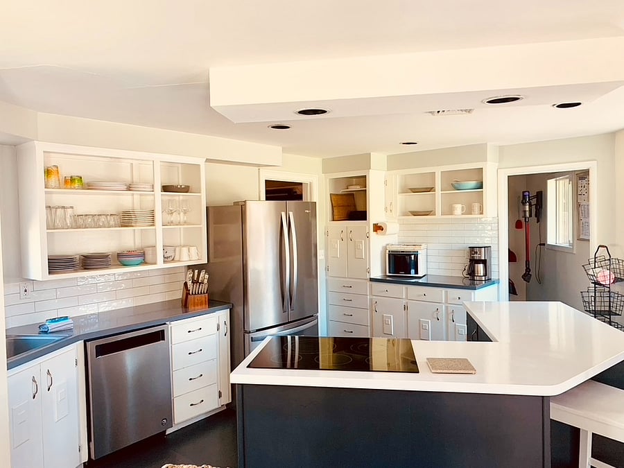 Fully equipped kitchen with all new appliances and center island open to the living and dining rooms