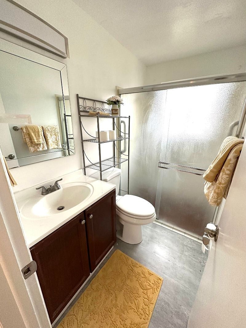 Bathroom with shower and starter toiletries 