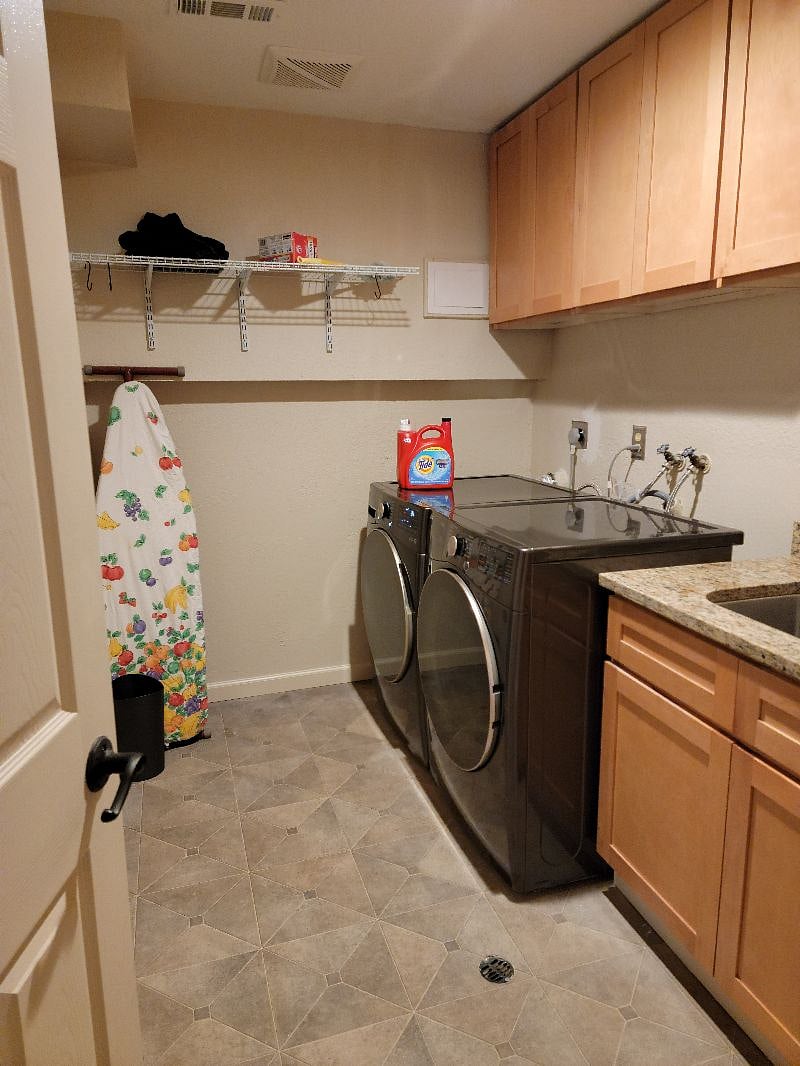 Laundry: high-efficiency washer and dryer, plus a utility sink