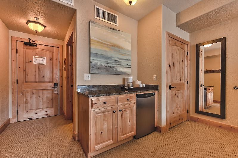 Each bedroom has a counter with a microwave oven, coffee maker, and a mini fridge.