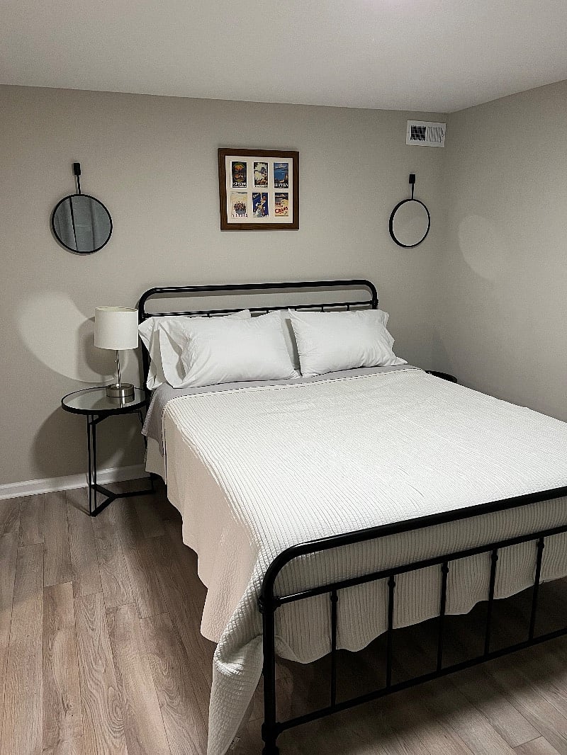 Foam queen mattress with new hypoallergenic pillow covers, extra sheets and blankets, and 2 nightstands.
