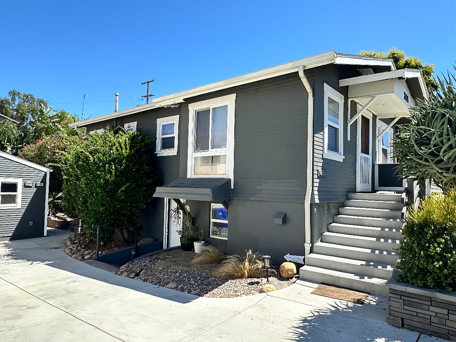 This is the front house. The Nest is in the back of the property and is accessible by a path between the front house and the unit at the end of the driveway, with fruit trees and privacy.