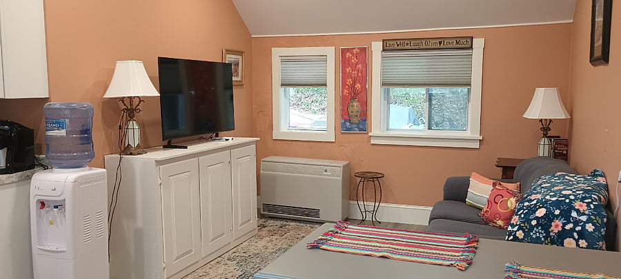 Comfortable furnishings in living room with a new smart tv.