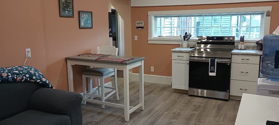 Full sized appliances, stove, dishwasher, microwave & refrigerator. Eat in kitchen bar top with two or three chairs available.