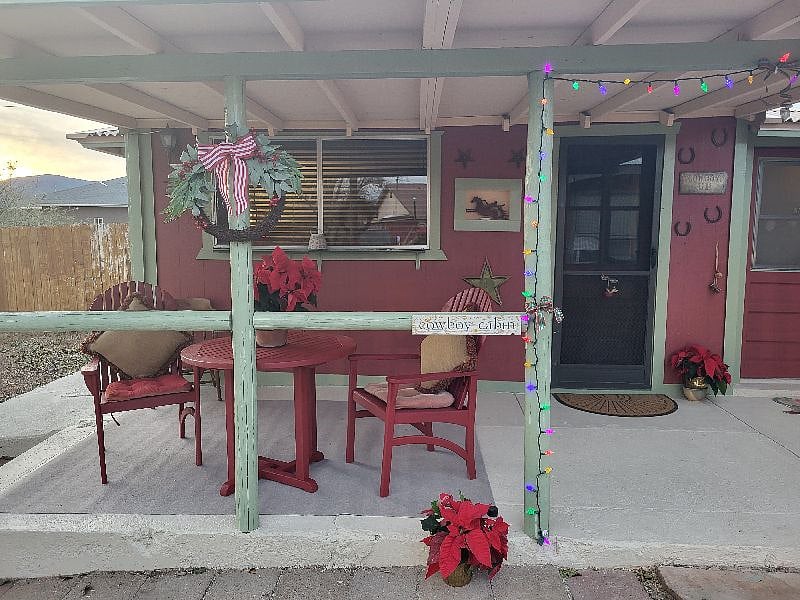 Porch now has a picket fence around it. This is an older photo.