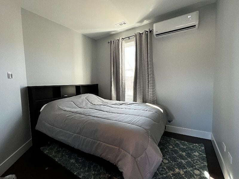 2nd bedroom with Queen Bed. The thing on the wall is the individual climate control (called a heat pump or mini split) one in each room, heat or cool to your personal preferances.