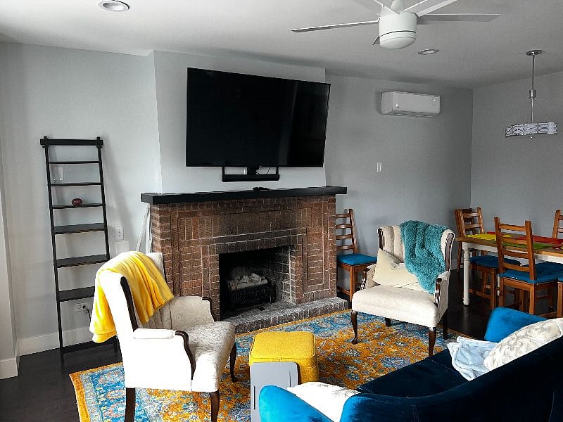 Electric fireplace that even makes crackling sounds replaces an old wood-burning fireplace.