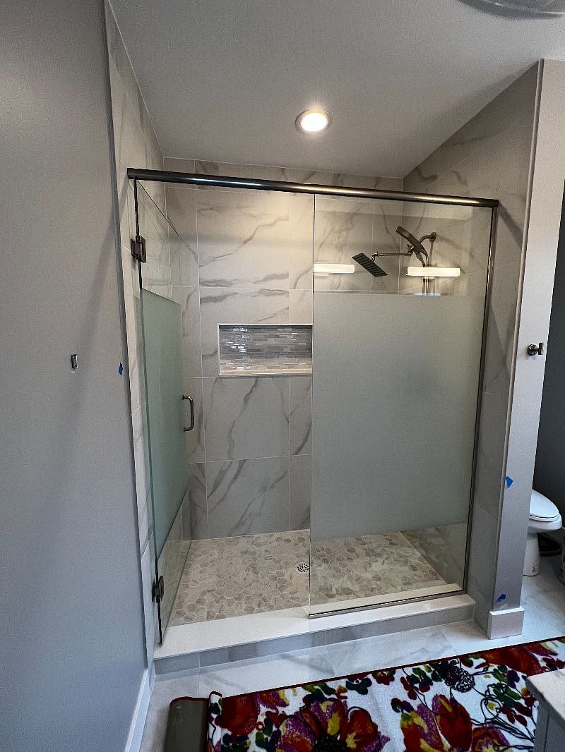 En suite bath with rainshower shower head and handheld for maximum convenience.
