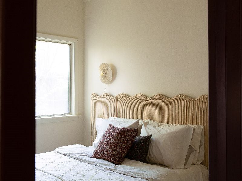 Cozy up in the light-filled queen bed with our hand-made deadstock corduroy headboard.