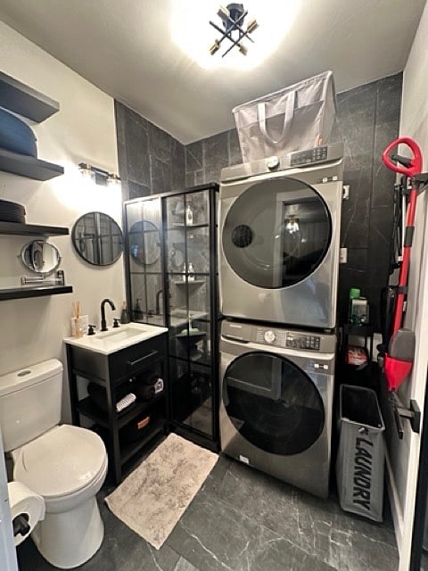 bathroom with full size washer and dryer.