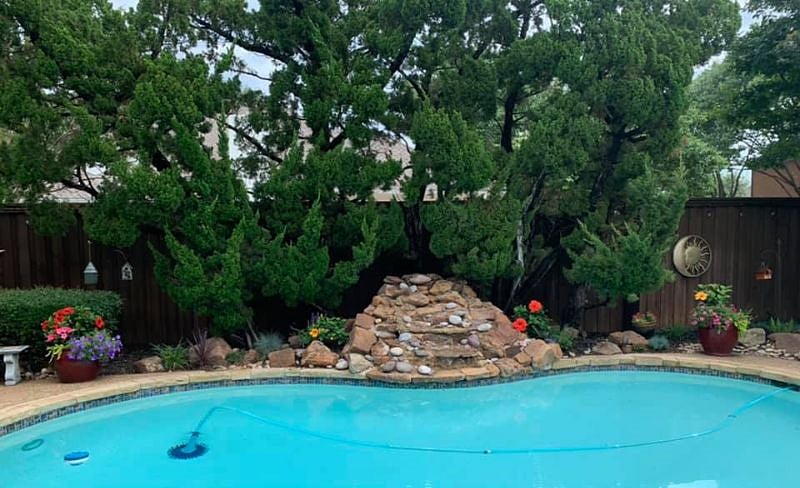 Backyard w tall fence, pool