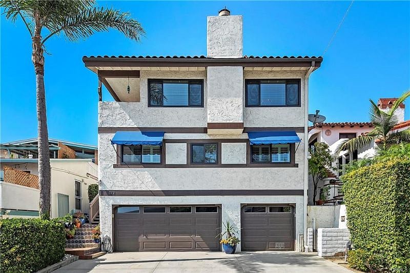 Left garage is ours. Inside garage is a pool table, TV, fridge, freeze, washer, dryer, beach equipment and 1 parking spot.