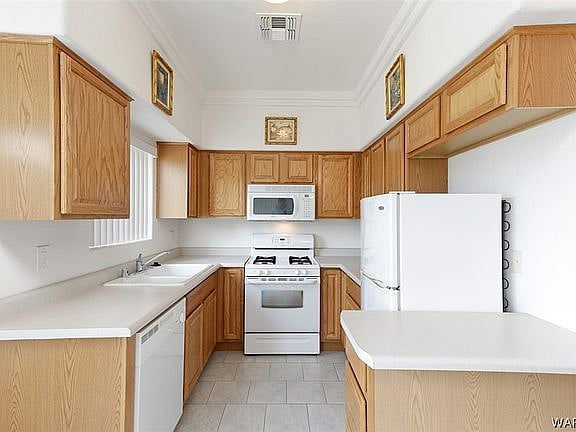 Nice Kitchen with dishwasher and full size fridge.