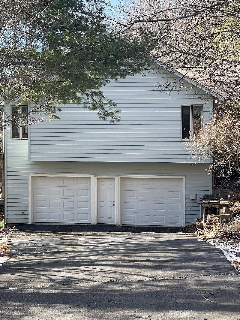 Driveway and garage side of house- the garage on the left is your dedicated parking space
