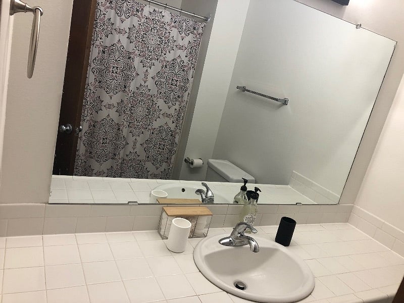 Shared bathroom in hallway, includes toilet paper, cotton rounds/balls and Qtips