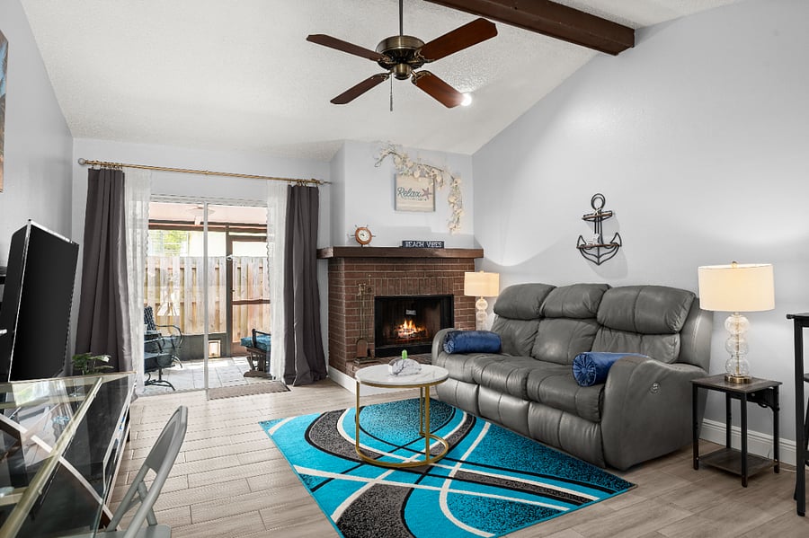 Gather, relax, and feel right at home in the bright living room, featuring soaring high ceilings and an abundance of natural light