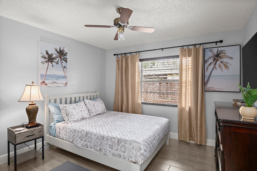Main Bedroom: Enjoy ultimate relaxation in the Master Bedroom, complete with a 55" Smart TV, ceiling fan, and window views!