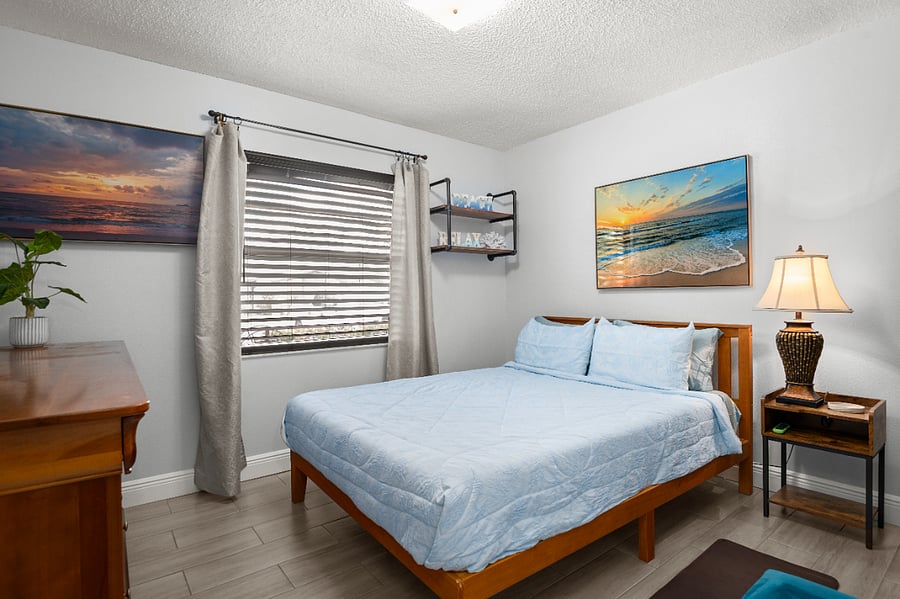 2nd Bedroom: Enjoy a 55-inch Smart TV and a window overlooking your private oasis