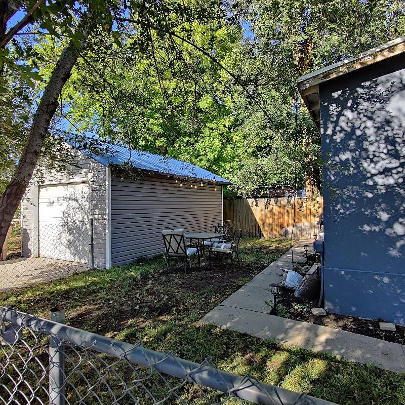 Fenced in yard to the left of the front door