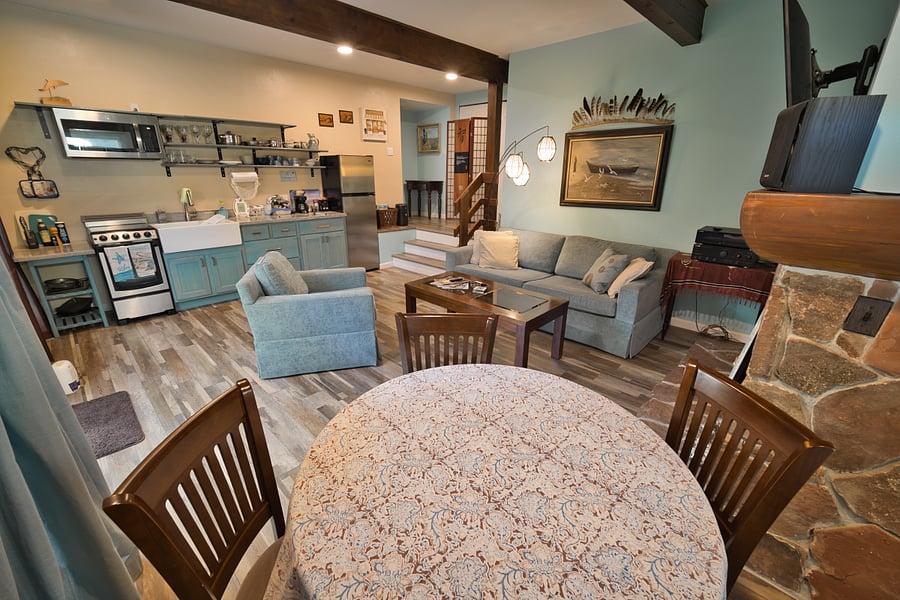 Main room with optional drop down leaf dining table to accommodate up to four guests.