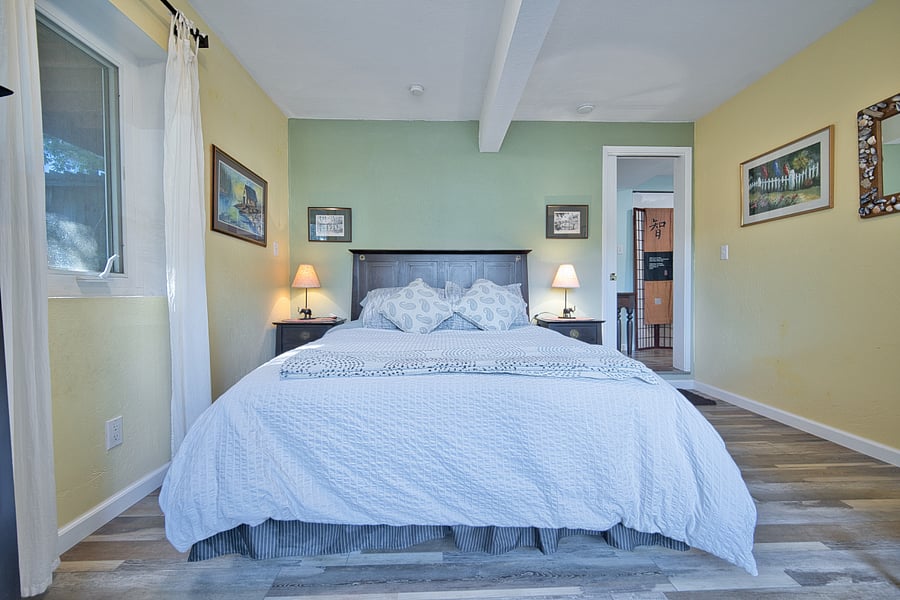 Ample sized bedroom with queen bed and new mattress as of August 2022. Two matching nightstands either side of the bed. Other amenities include matching headboard, dresser and nightstands.