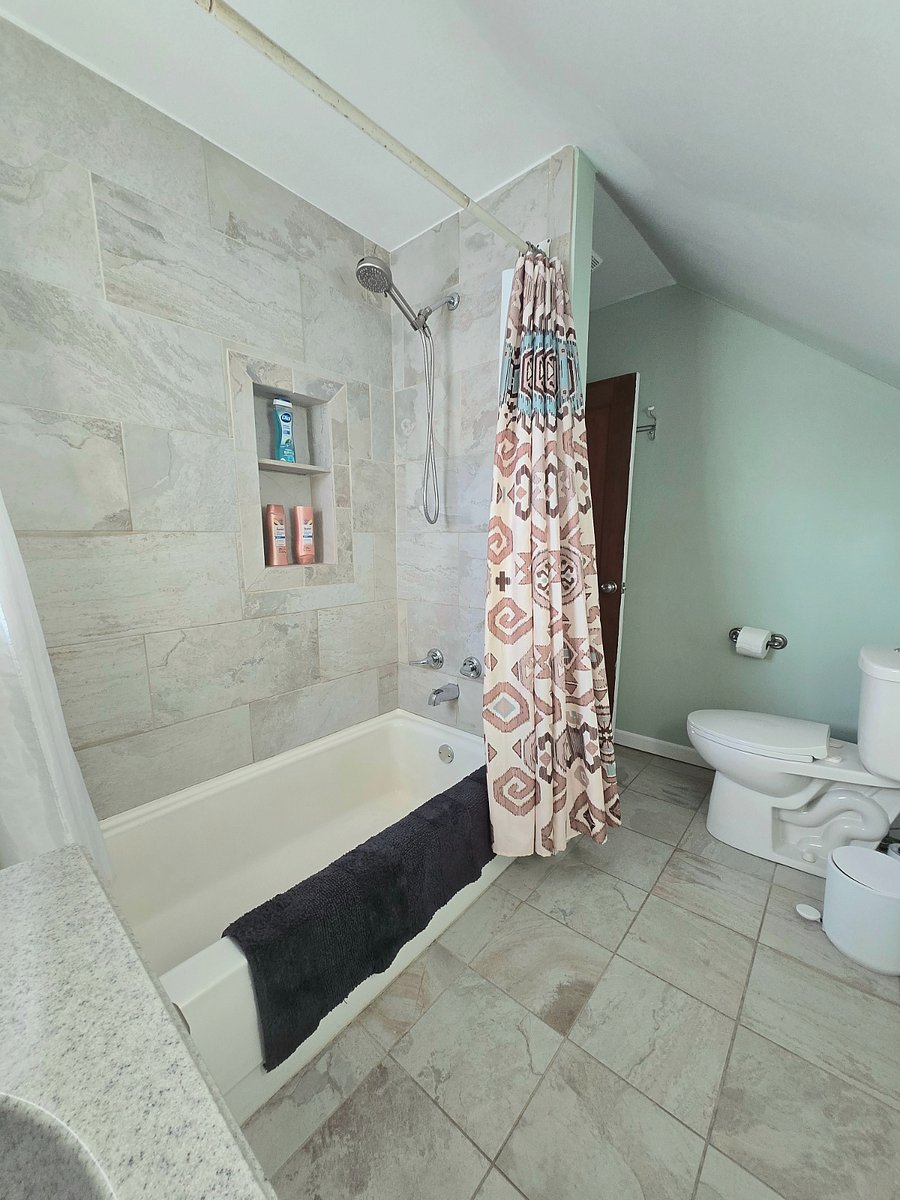 Bathroom located upstairs. Has great water pressure!