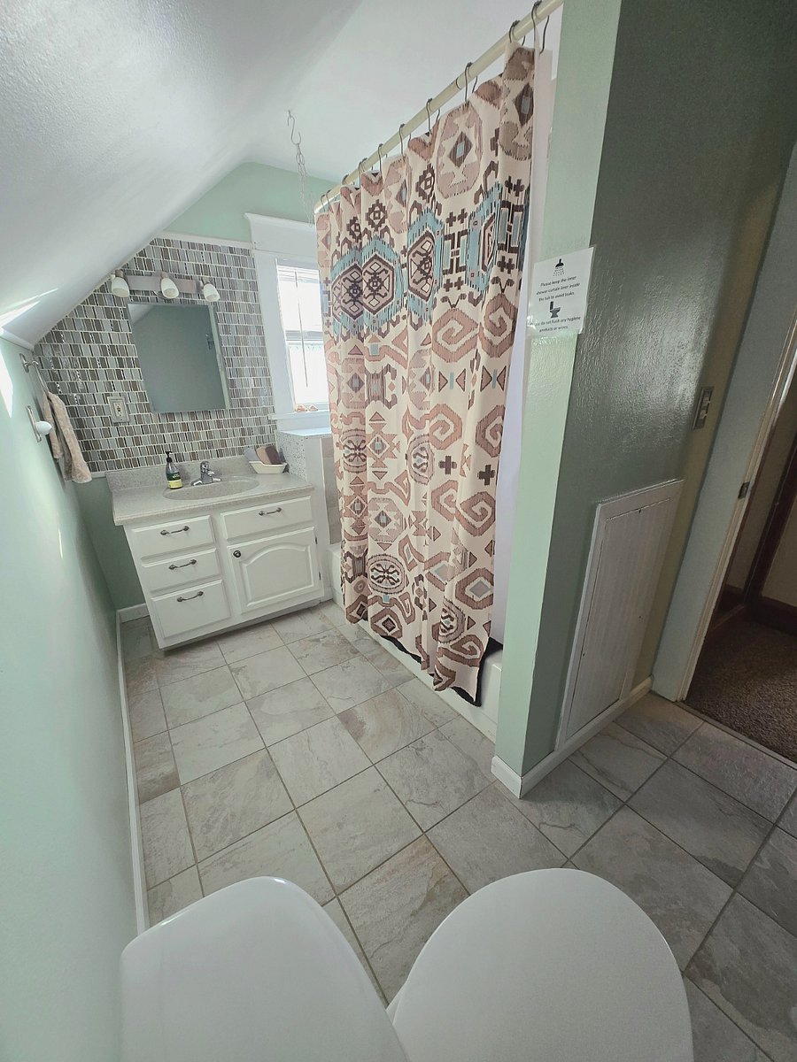Bathroom located upstairs. Has great water pressure!