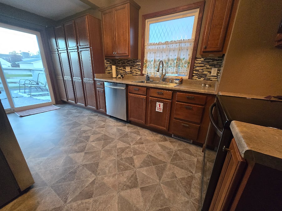 Plenty of storage space! Kitchen sliding door opens to privacy fenced backyard
