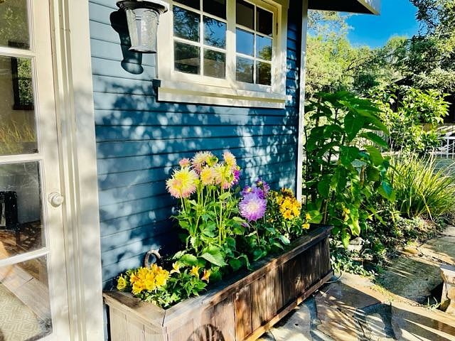 Flowers welcome you at the front door.