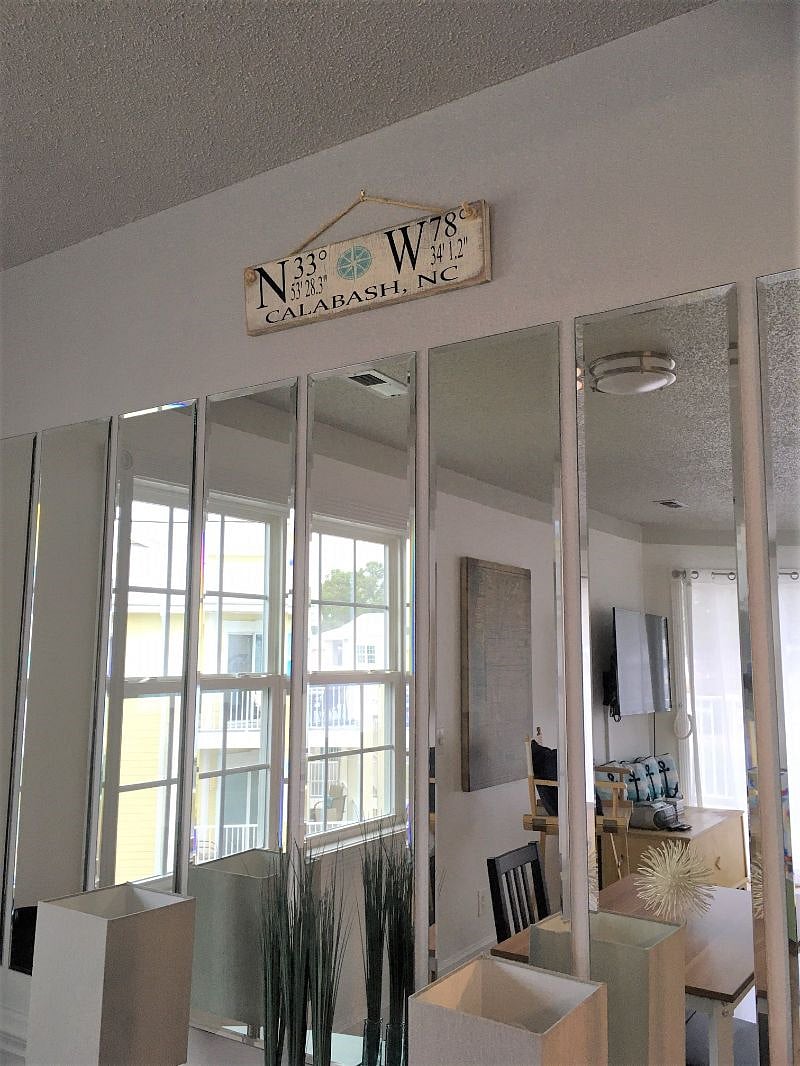 Bright interior features abundant windows, 2 sliding doors and mirrors to bring the sunny view indoors.