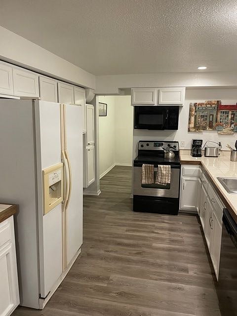 kitchen (opening goes to pantry/additional storage space)