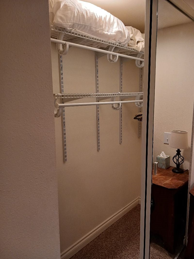 Lighted closet in bedroom