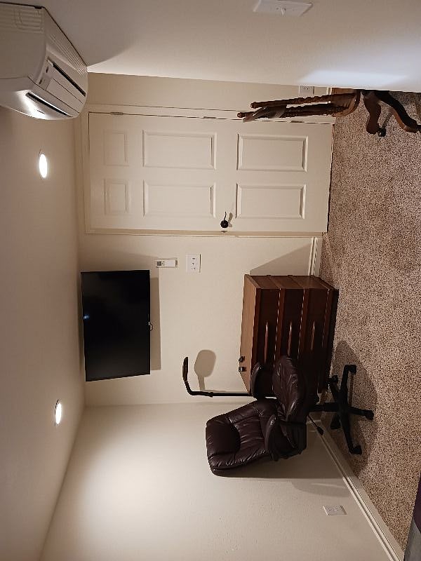 42" TV in bedroom, additional chairs, desk.