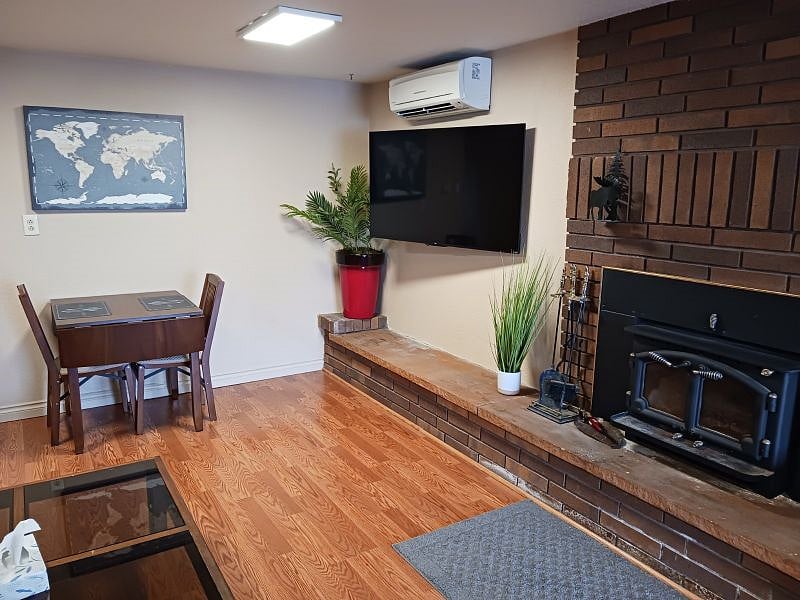 TV, woodstove, dinning, ductless heat/AC unit.