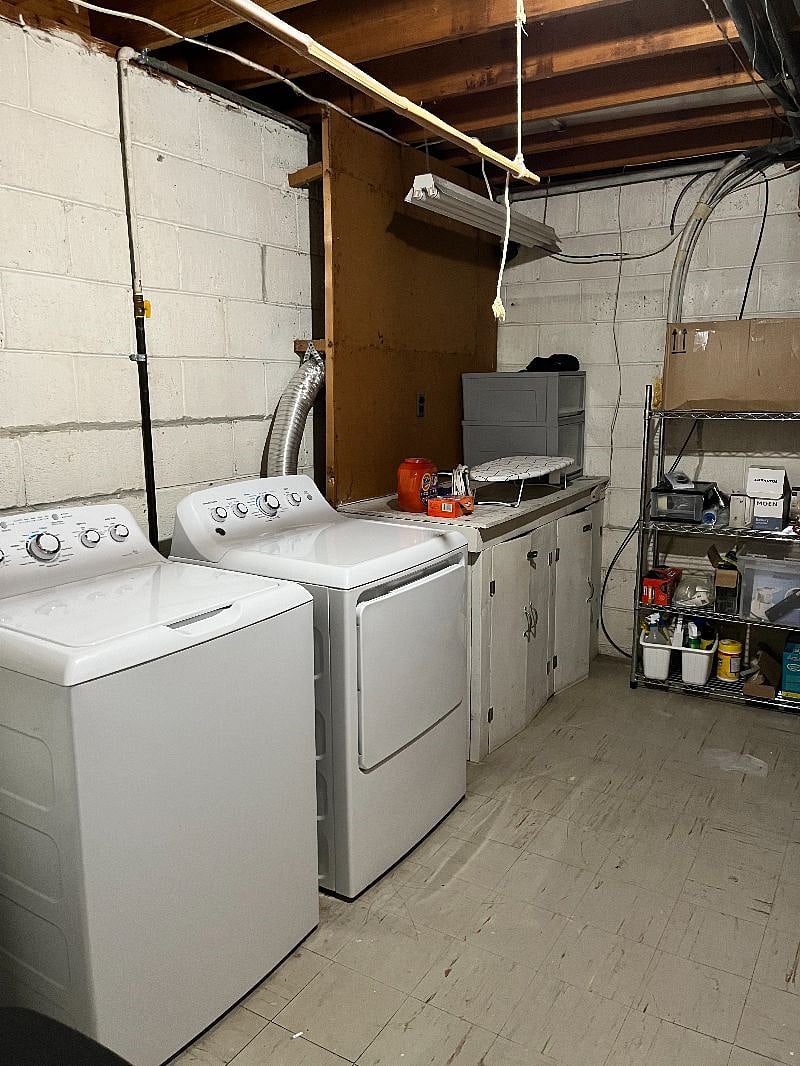 Laundry room has detergent, ironing board and bamboo rod if you need to hang clothes dry. 