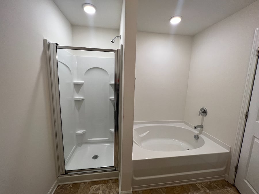 Downstairs bedroom, private bathroom walk-in shower and tub