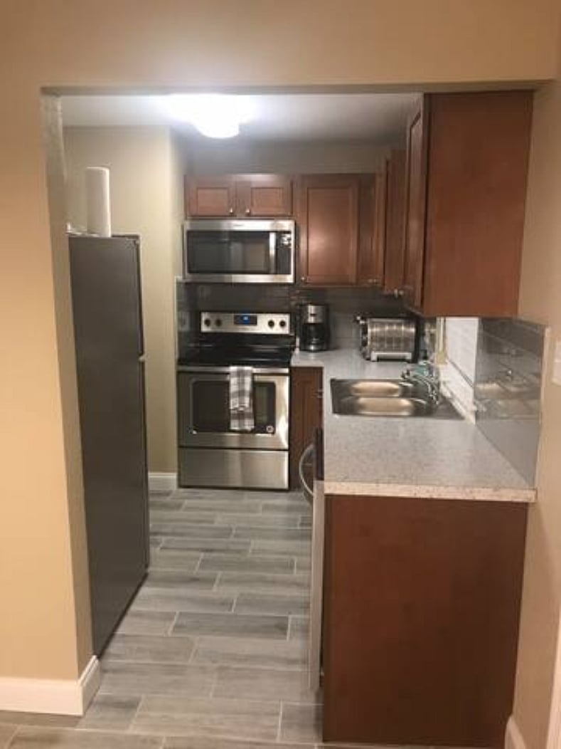 Clean fully appointed kitchen including quality cookware for an at home experience.