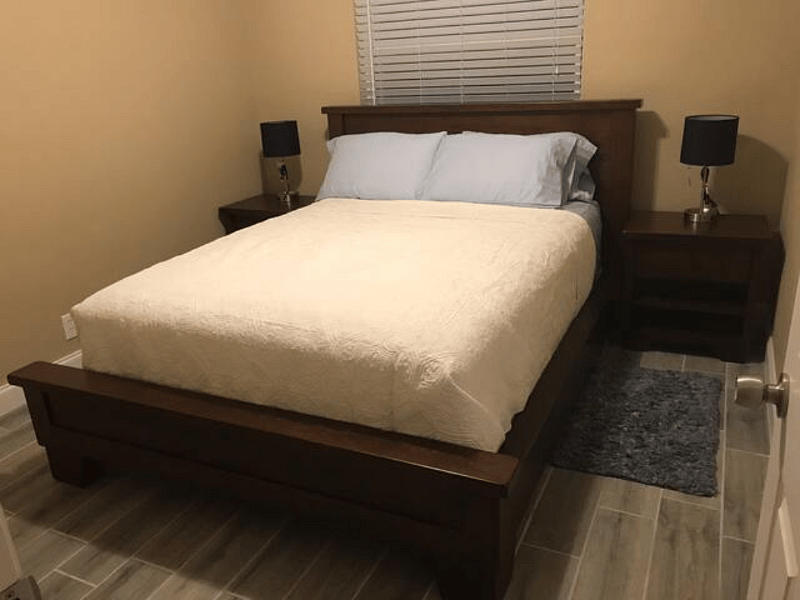 Second bedroom with Pottery Barn solid wood queen size bed for family or guest. 