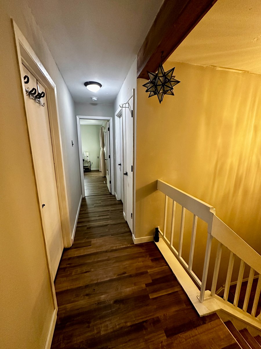 The upstairs corridor features both a linen closet and a coat closet.