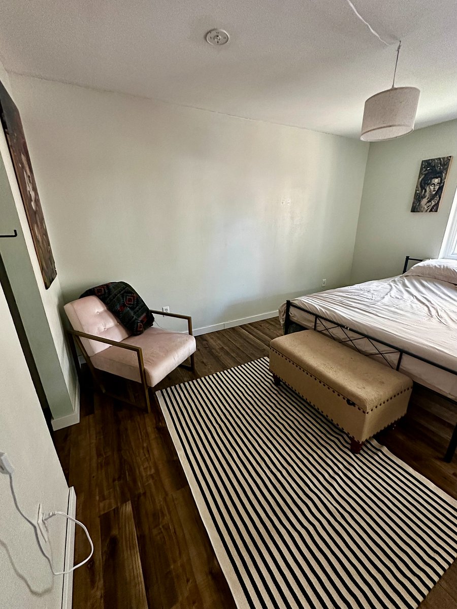 The master bedroom is spacious and light filled, and it has a patio door that leads to the quaint backyard!