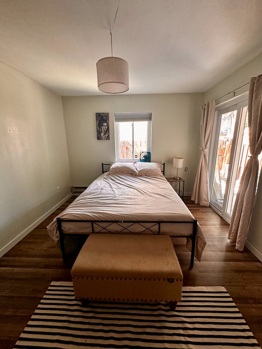 The master bedroom leads to the patio and backyard -- ideal for dogs who like to go out late at night. You don't even need to leave the bedroom!